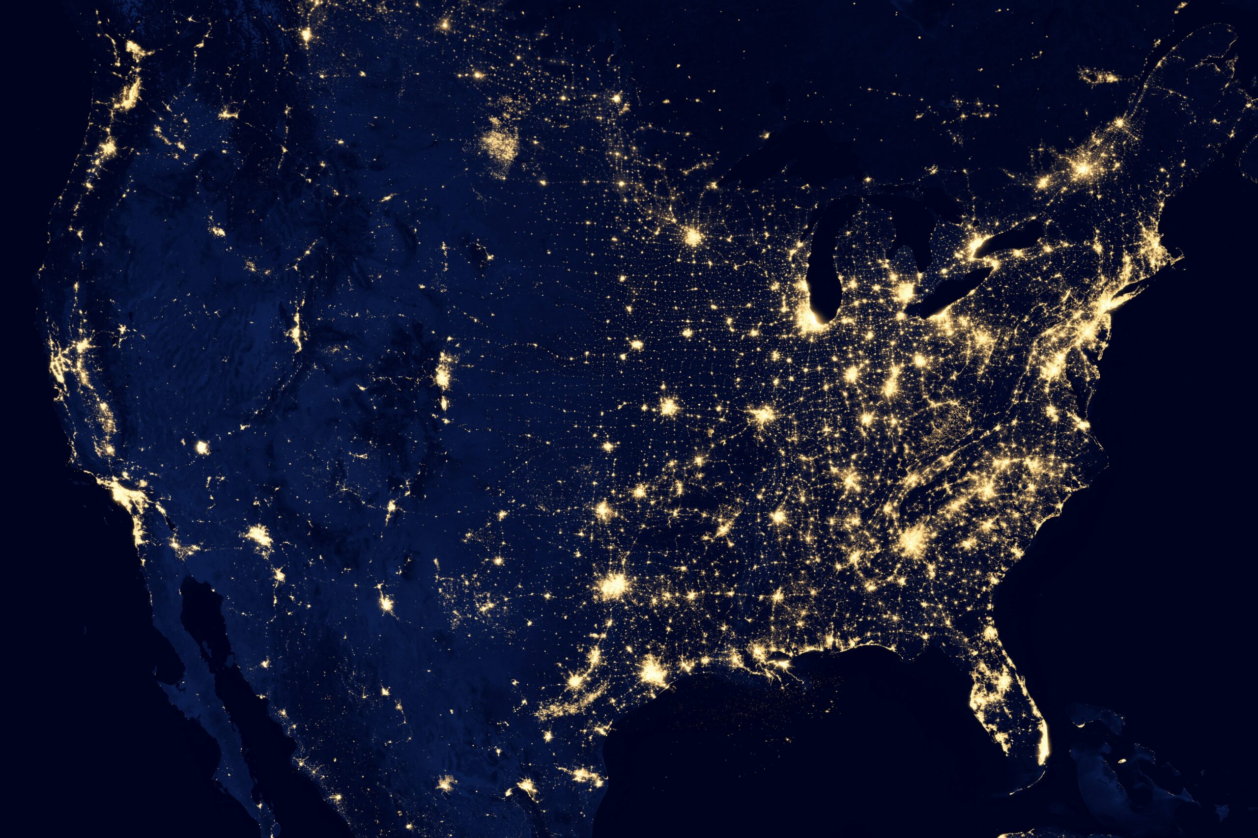 An image of interconnected lights from space indicating networking